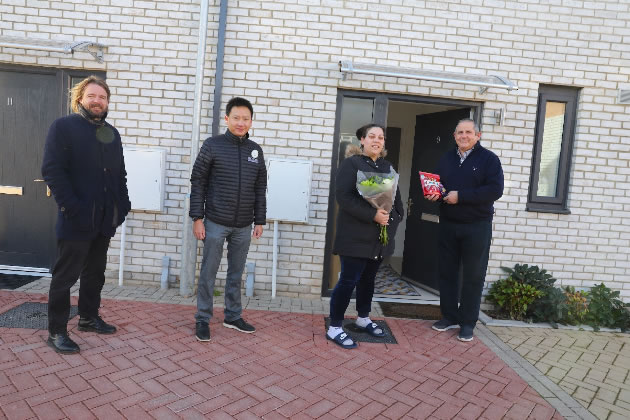 Matt Townend, Chief Operating Officer at Ecoworld, Heng Leong Cheong, CEO of EcoWorld London, and Cllr Steve Curran welcome Layla el-Hussein to her new home