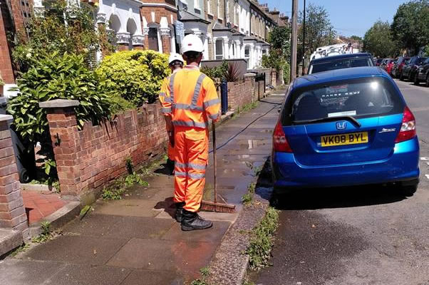 Hosing down pavement