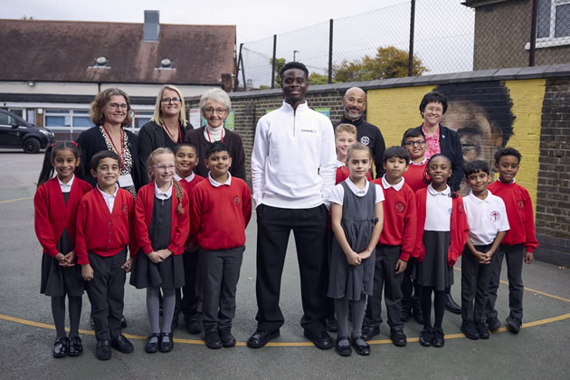 Bukayo in the playground with children and staff from Edward Betham 