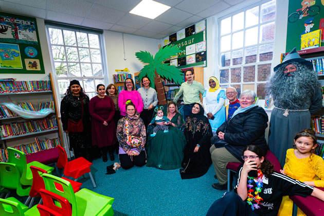 YEF CEO Elly Heaton with library volunteers 