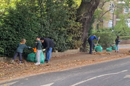 Ealing North Cub Scouts Blitz Leaves on Slippery Pathways
