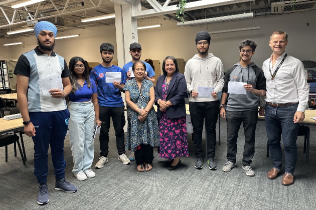 Left to right, Mr Matthew Benson, Tajvir Jhamat, Gurvir Singh, Mrs Aruna Sharma (Headteacher), Mrs Gopali Nagi, Usayd Hussain, Mohammad Irfan, Malaviha Baheetharan and Ravninder Singh.