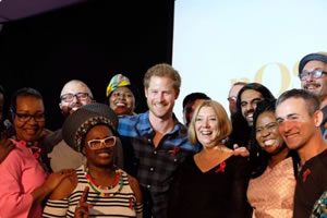 Prince Harry posing with members of Joyful Noise choir