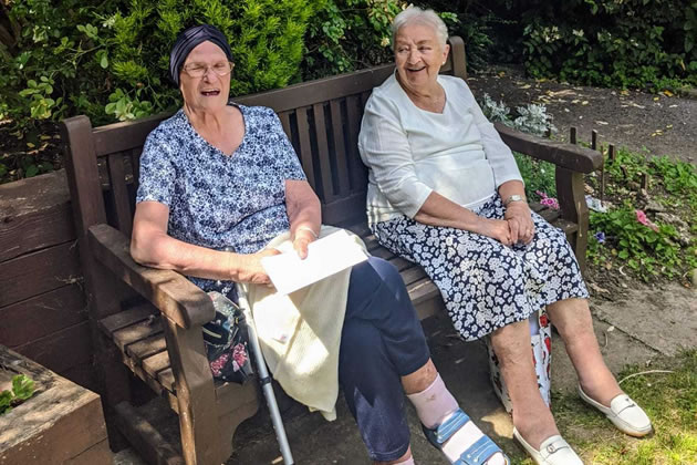 Lillian Urban (left) and friend Doris at AgeUK centre's garden. Picture: AgeUK